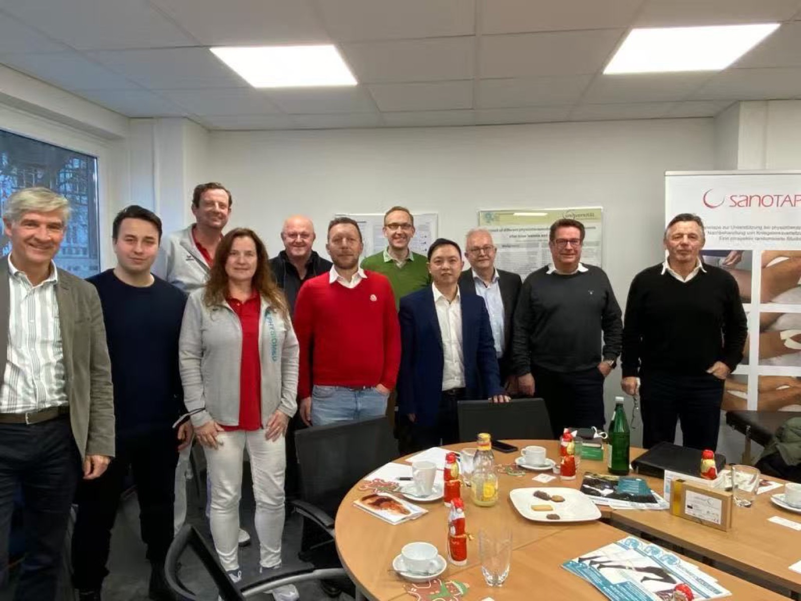 F.L.Y team gathering around a meeting table
