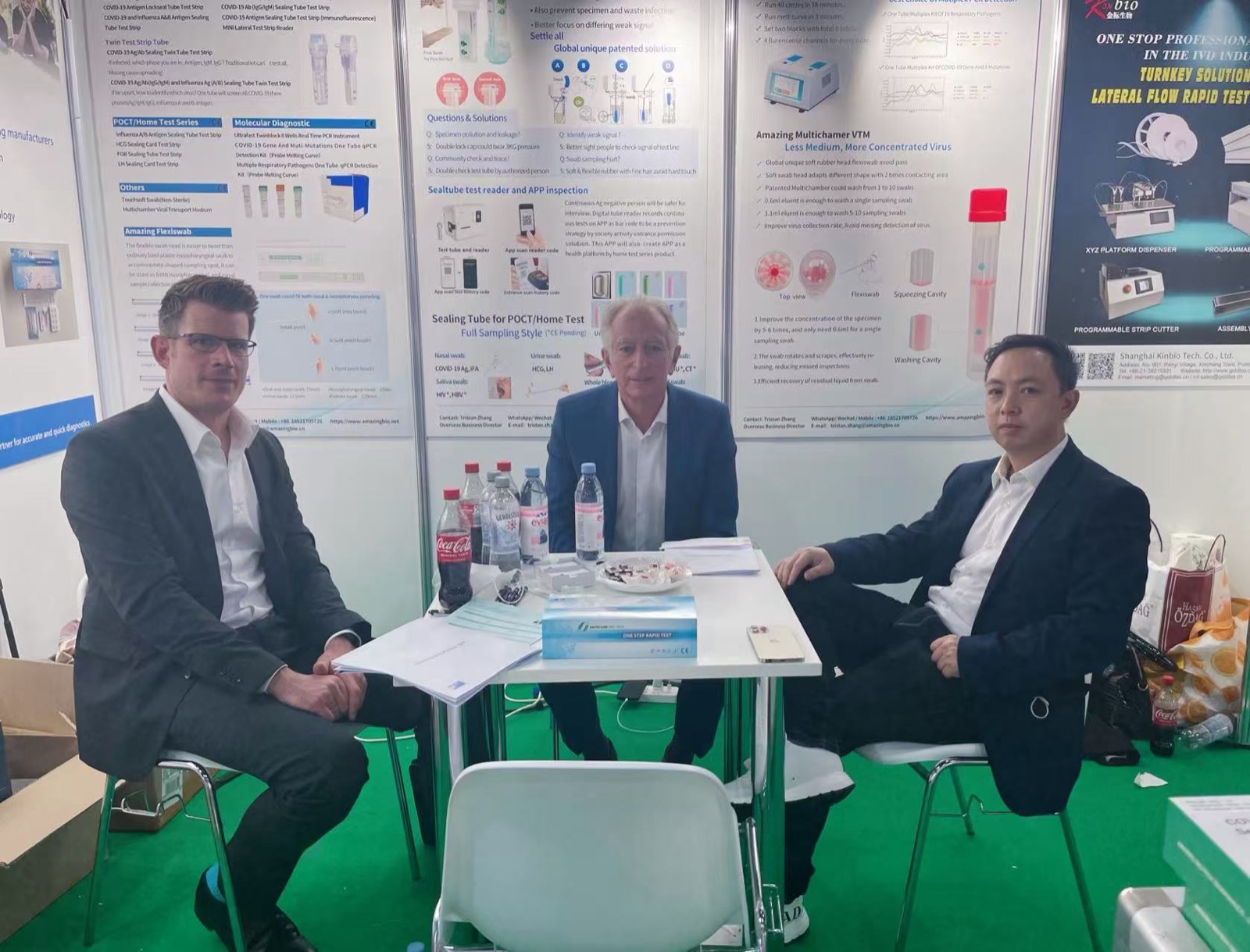 Business discussion at a healthcare exhibition stand